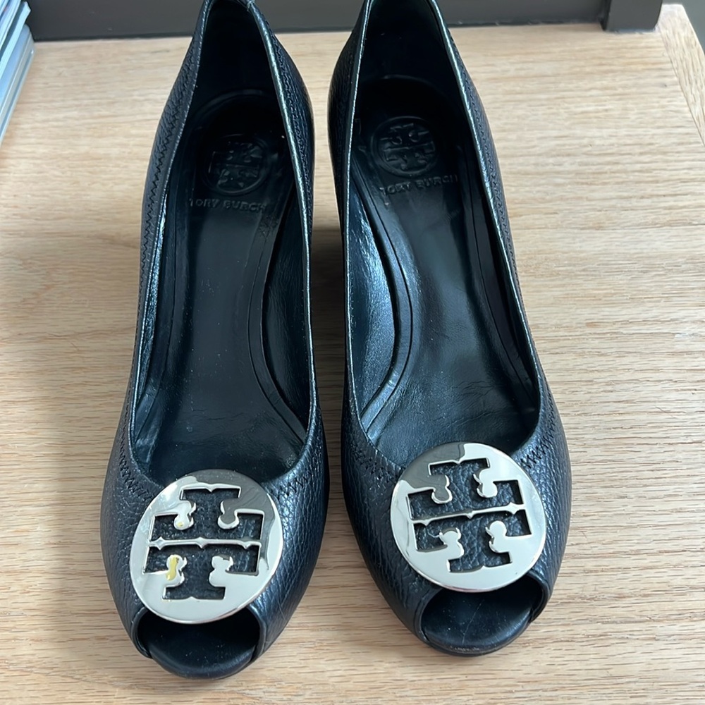 Tory Burch Black Leather pumps with a 2 1/2 inch wedge.